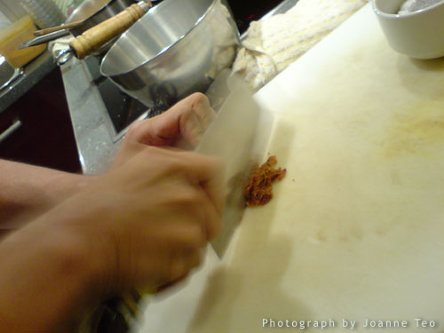 Slicing up Gula Melaka