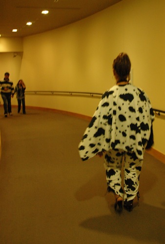 Woman in cow print suit Woman in cow print suit