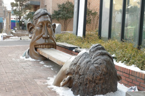 Head eats a chair. Head eats a chair.