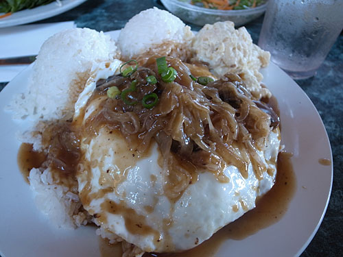 Loco Moco Plate Lunch Loco Moco Plate Lunch that consists of two scoops of rice, a scoop of mac potato salad, eggs over easy, a big humburg steak hiding under the eggs
