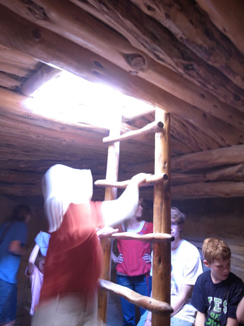 Climbing out of a kiva. Climbing out of a kiva.