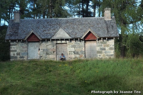 Man reading near the River Quioch. Man reading near the River Quioch.