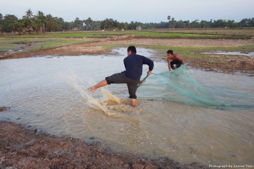 Village visit. Fishing in the padi fields.