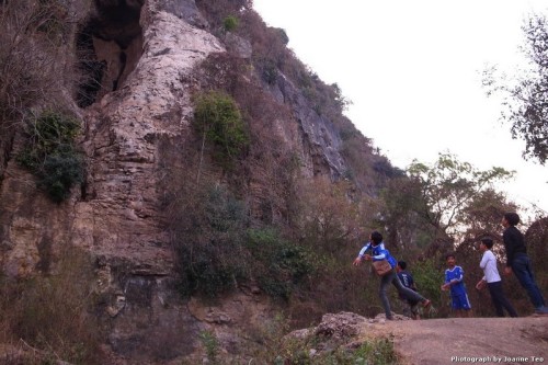 Kids throwing stones at the bat cave.